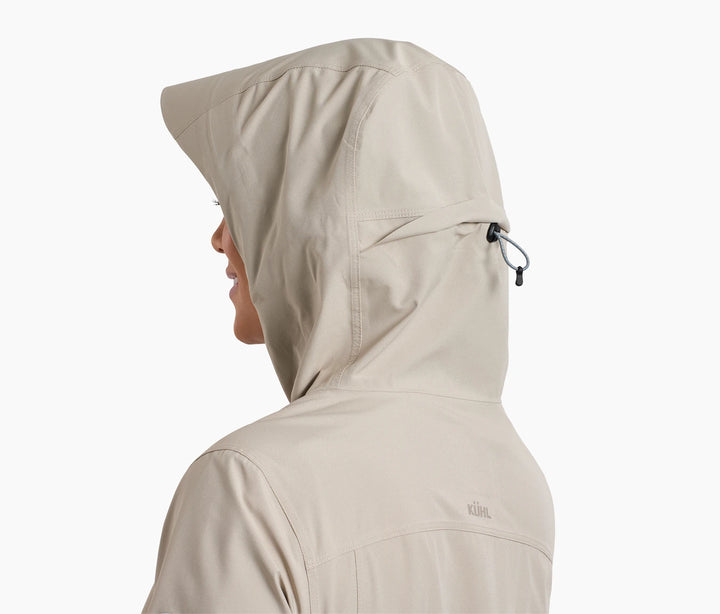 Side and back of the shoulders and head of a woman wearing a hooded raincoat