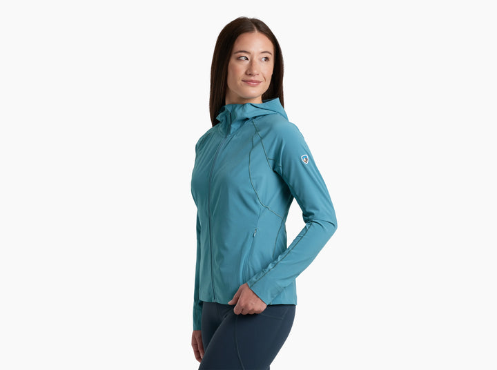 A woman modeling a teal blue hooded athletic jacket against a plain white background.