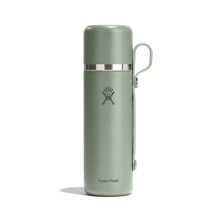 Matcha green thermos bottle with Hydro Flask logo and a carry strap on a white background