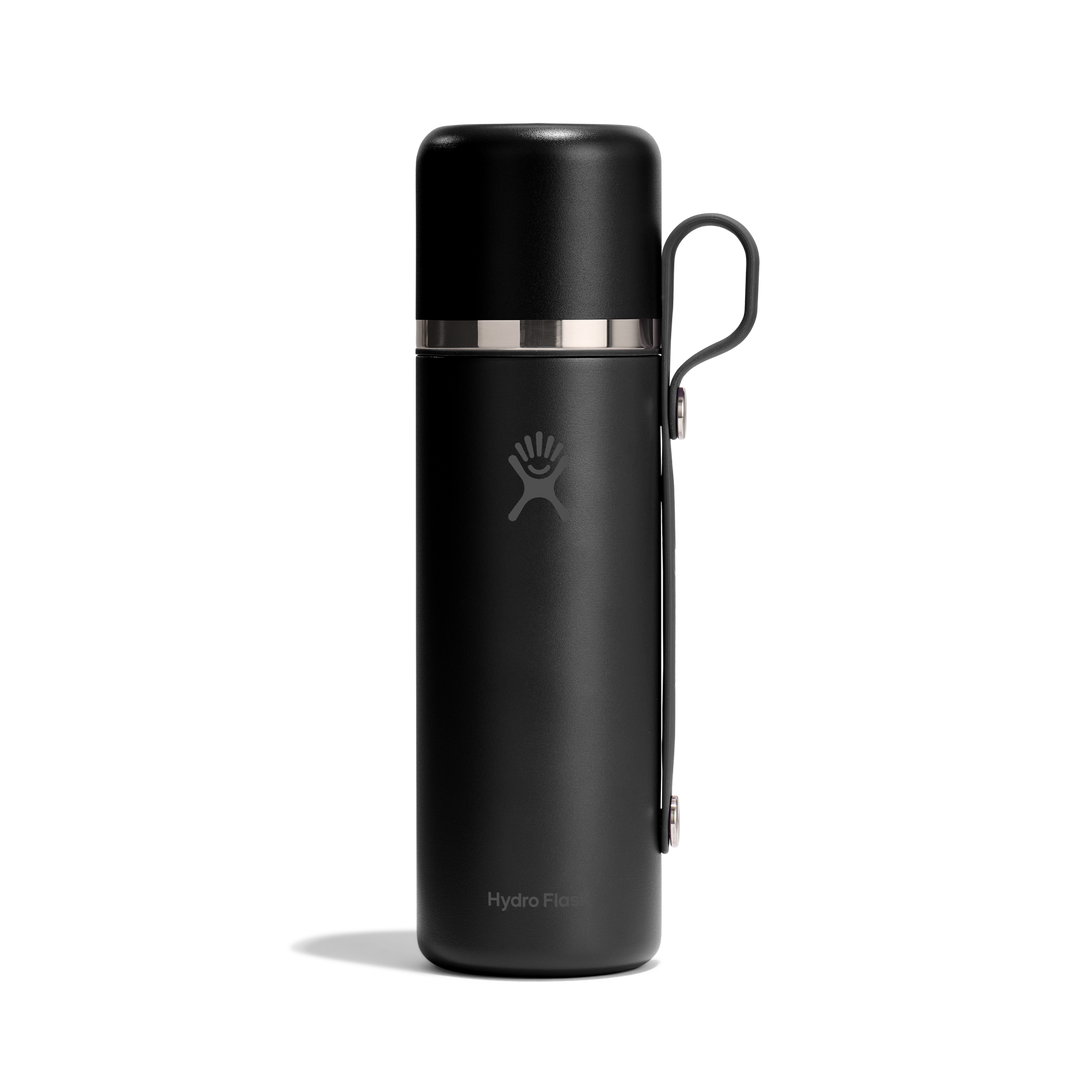 Black thermos with Hydro Flask logo and carry handle on a whitebackground