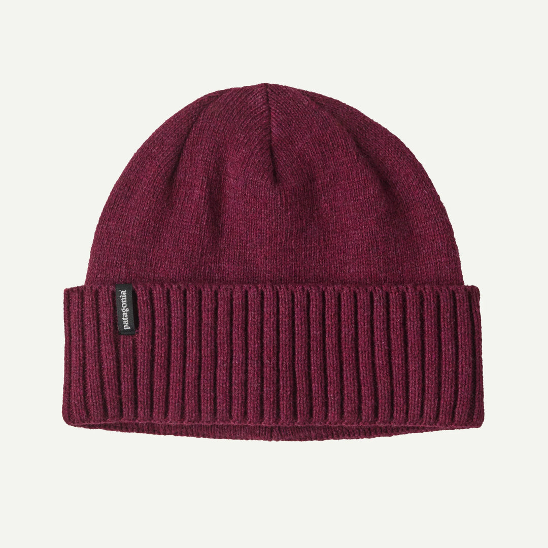 Maroon knit beanie with a brand label on a white background