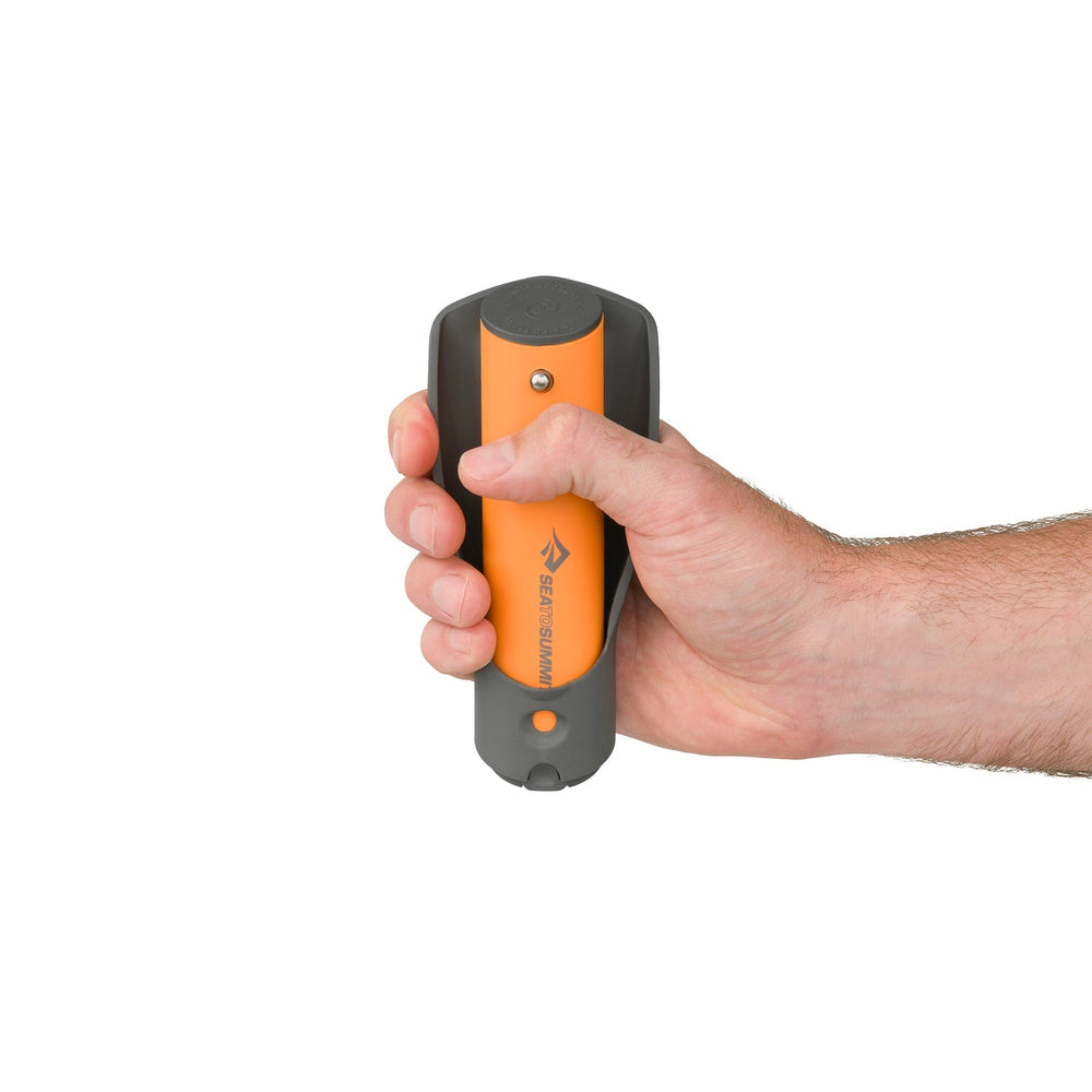 Hand holding a collapsed telescopic nylon pocket trowel