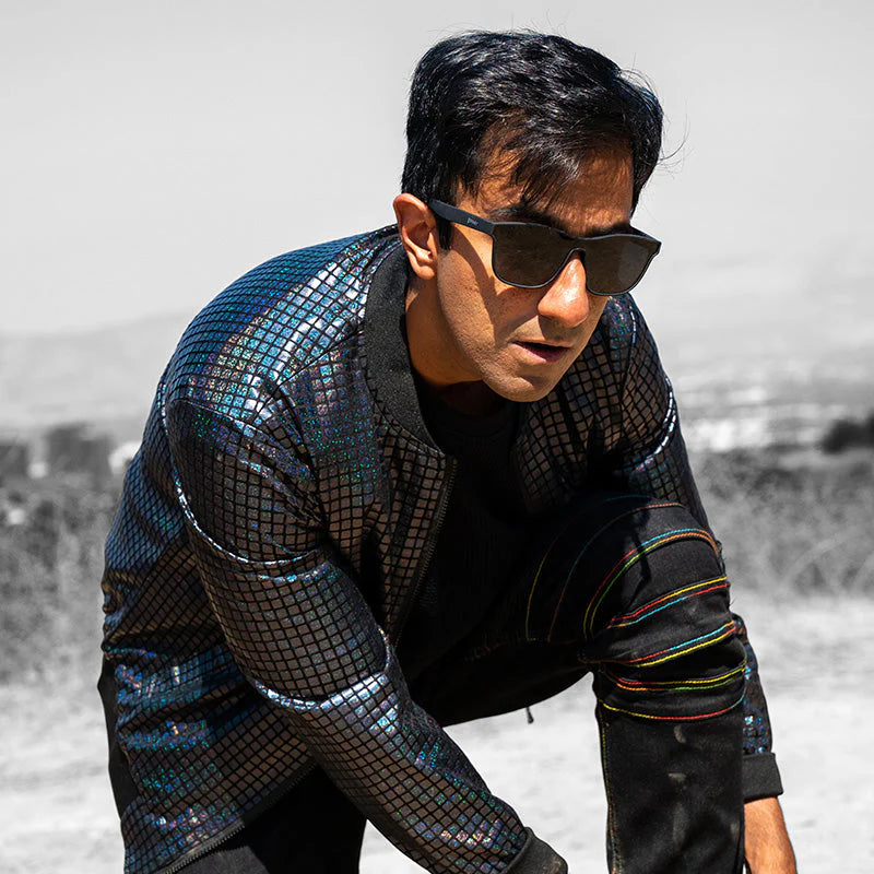 Man wearing shiny jacket and sunglasses outdoors