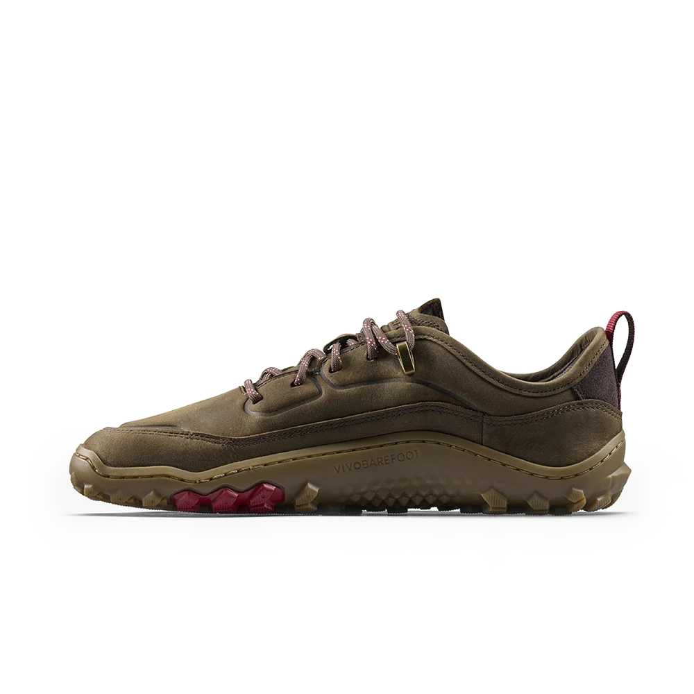 A single Vivo barefoot shoe in olive brown suede and synthetic materials, featuring brown laces, a dark brown collar, and magenta accents on the outsole and heel pull tab, shown against a plain white background.