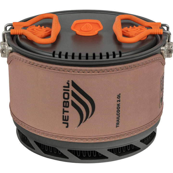 Jetboil camping stove with brown cosy and orange handles on a white background