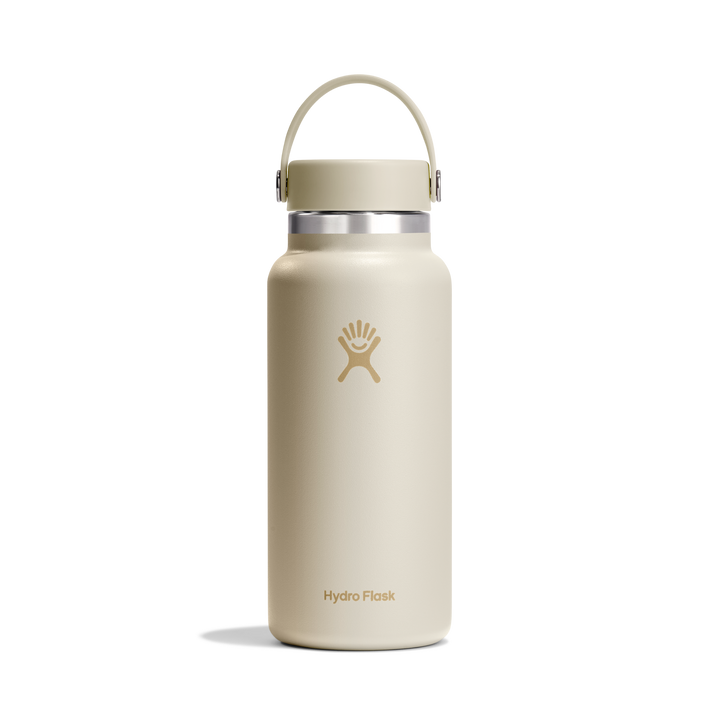 Cream insulated water bottle with Hydro Flask logo and pivoting handle on a white background