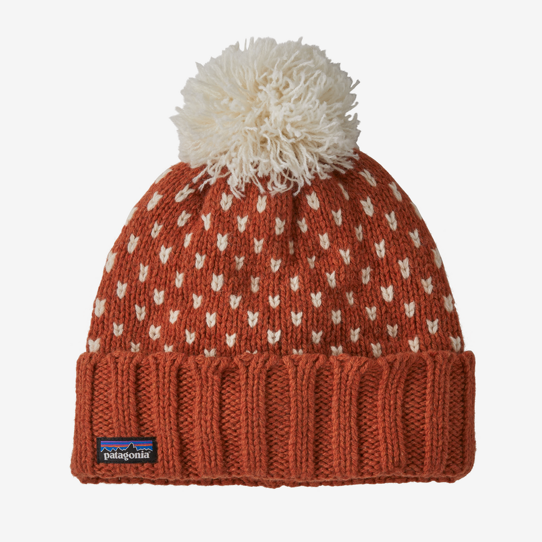 Knitted beanie with white pom-pom and Patagonia logo on a white background