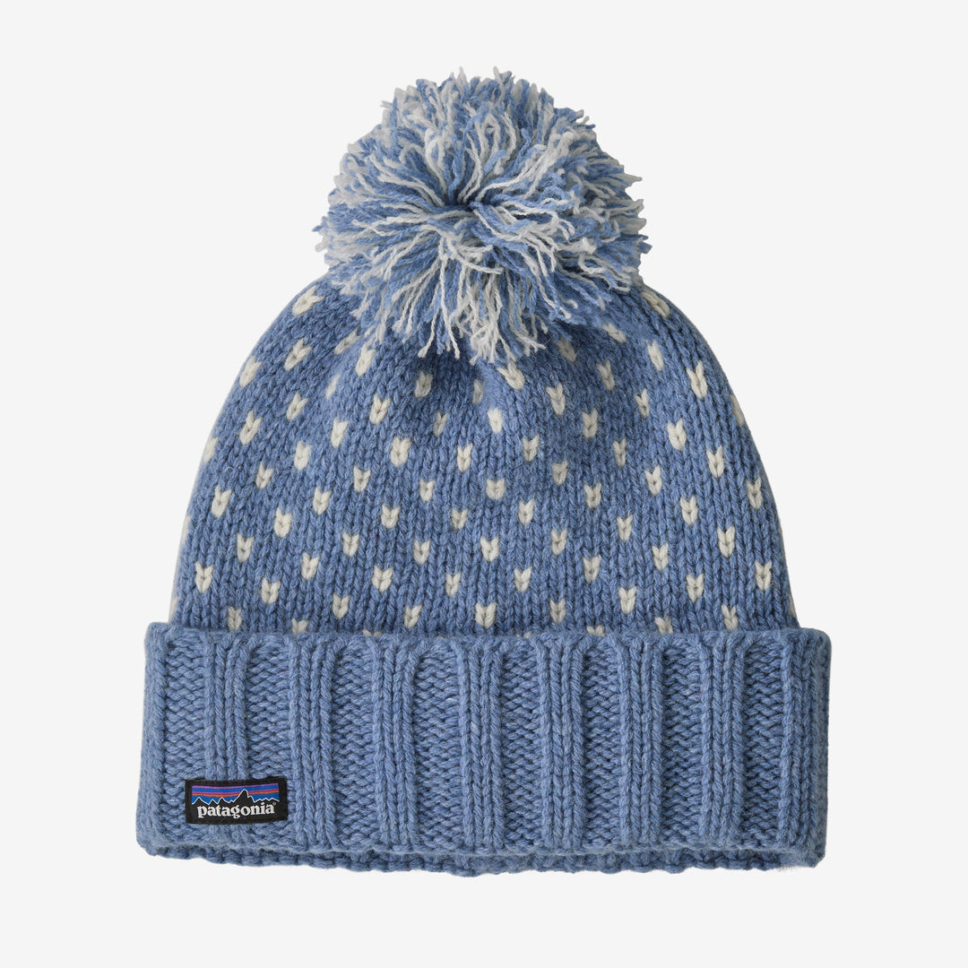 Blue knit beanie with pom-pom on a white background