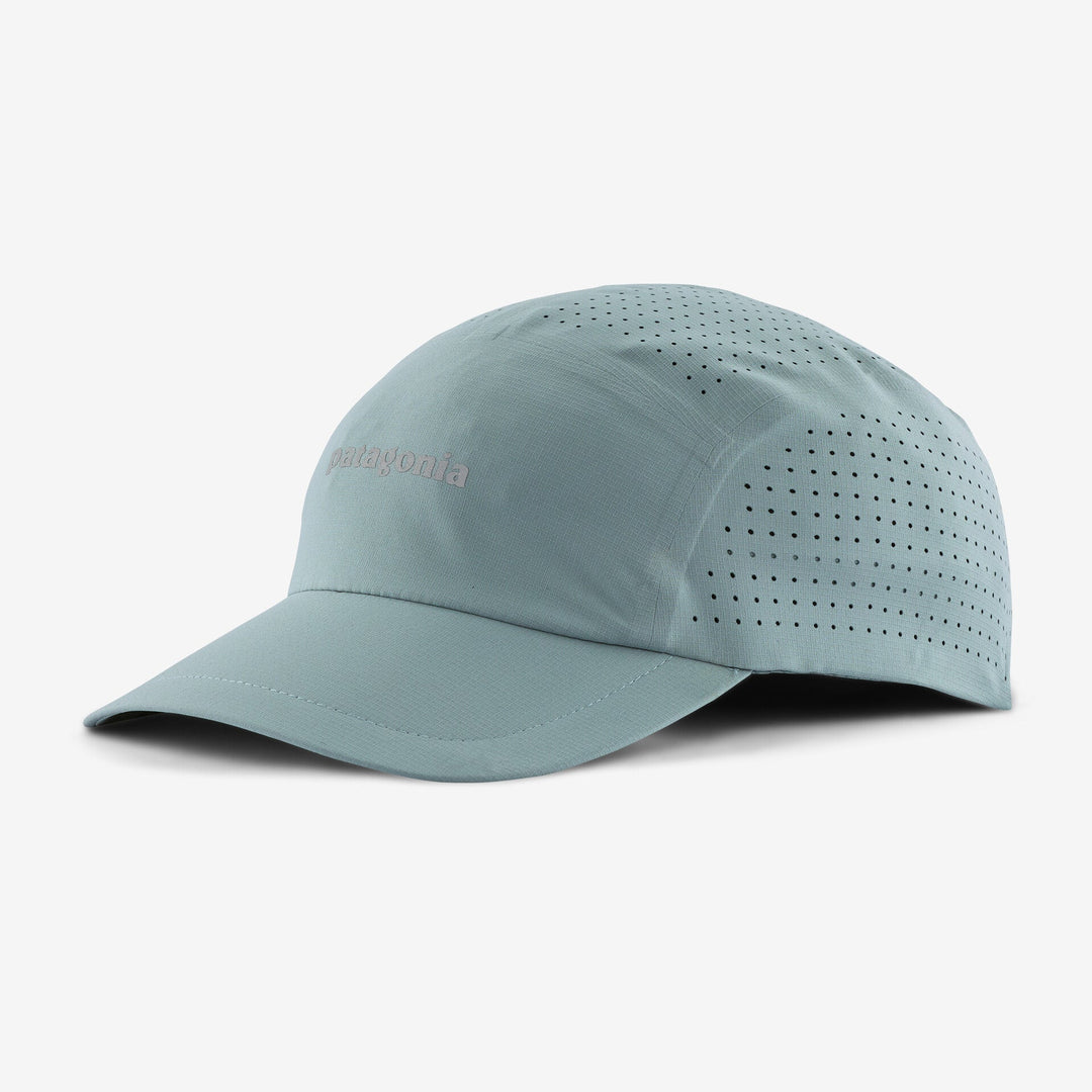 Light blue baseball cap with perforated design on a white background