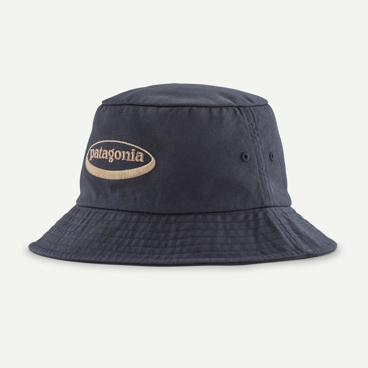 Navy bucket hat with Patagonia logo on a light gray background
