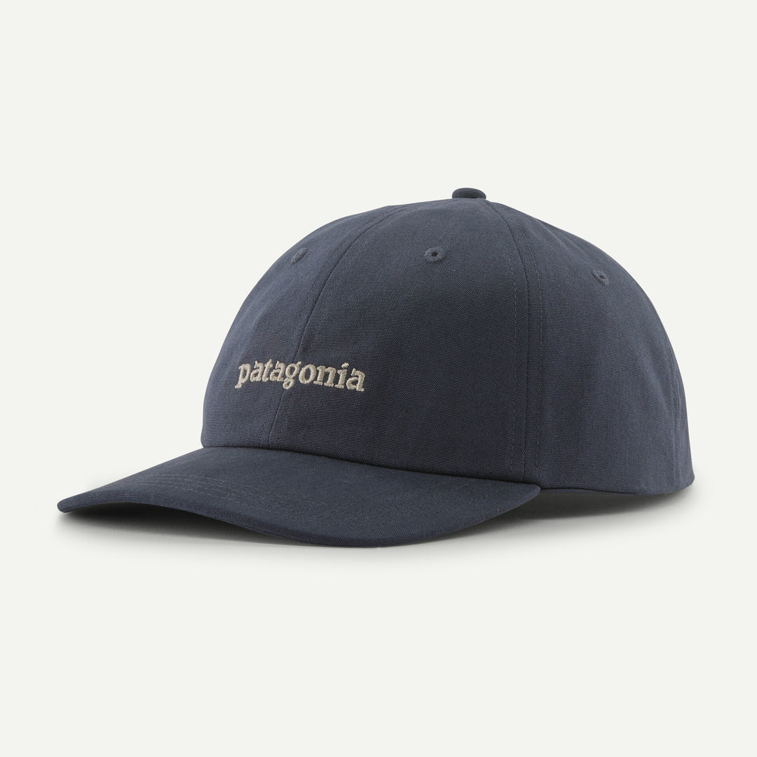 Navy blue cap with embroidered designs on a white background