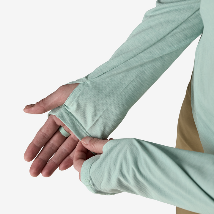 Close up of sleeves and thumb holes on a white background