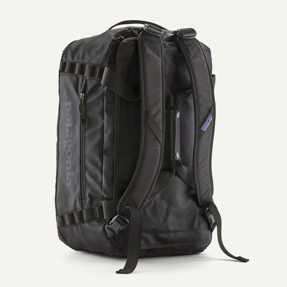 Black backpack with visible Patagonia branding on a white background