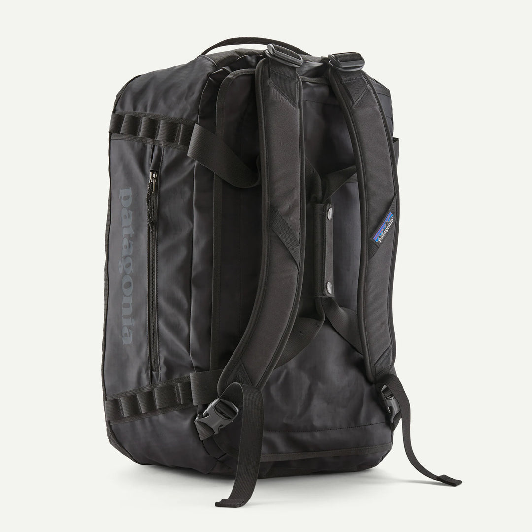 Black backpack with visible Patagonia branding on a white background