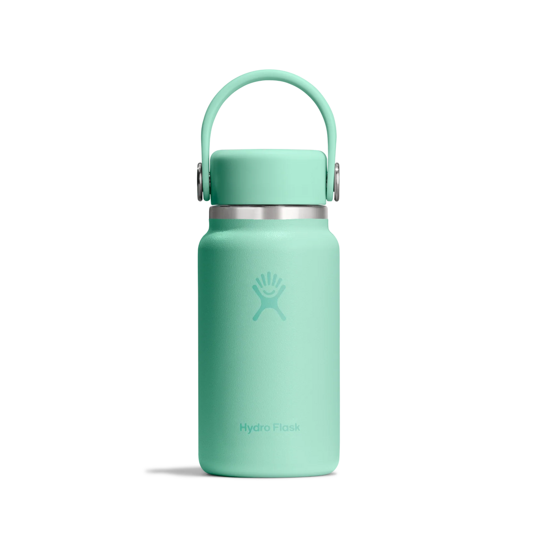 A mint green Hydro Flask insulated water bottle with a matching carrying loop lid and a silver metal band, shown on a clean white background.