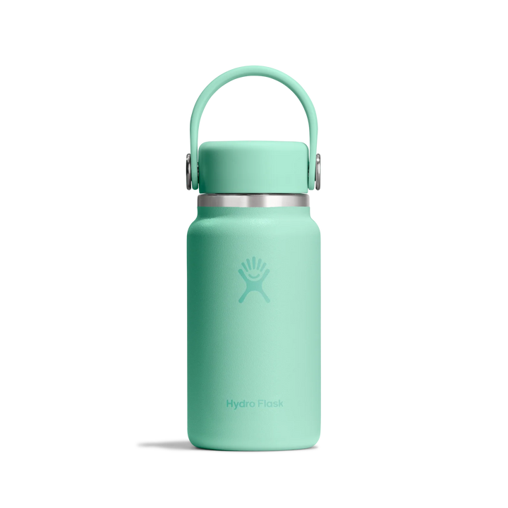 A mint green Hydro Flask insulated water bottle with a matching carrying loop lid and a silver metal band, shown on a clean white background.