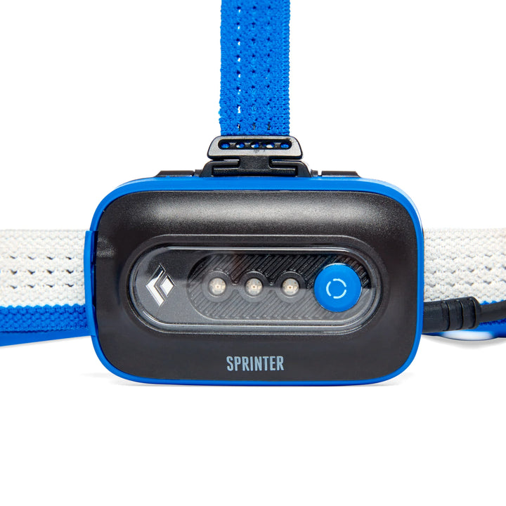 Black Diamond Sprinter headlamp with blue strap on a white background