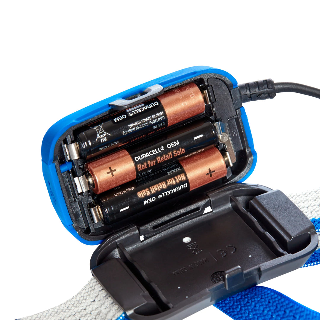 Battery charger with Duracell batteries on a white background
