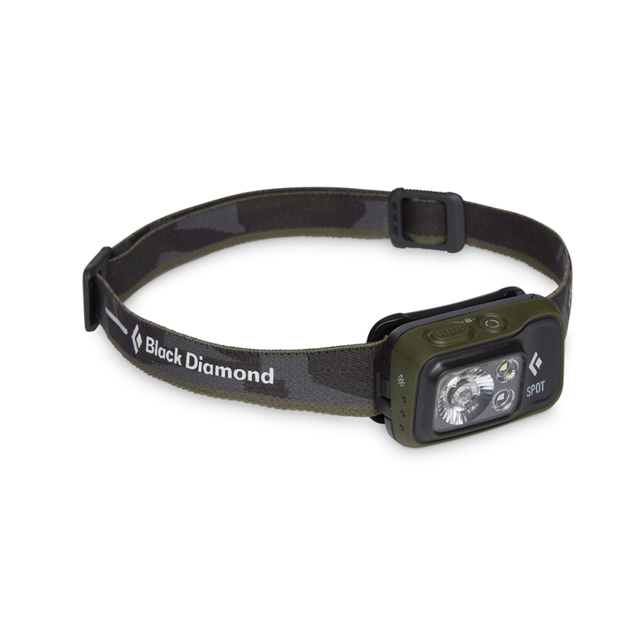 Black and dark green headlamp on a white background