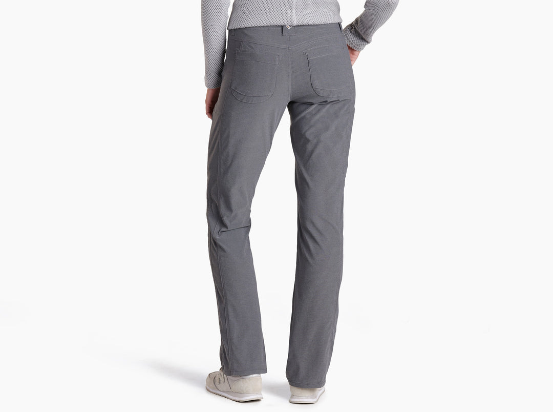 Person wearing charcoal coloured pants on a white background.
