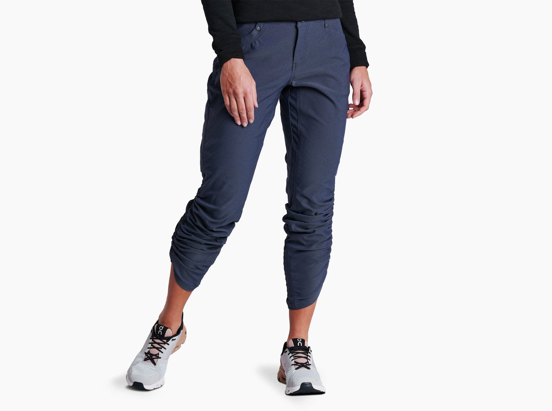 Person wearing Indigo pants on a white background