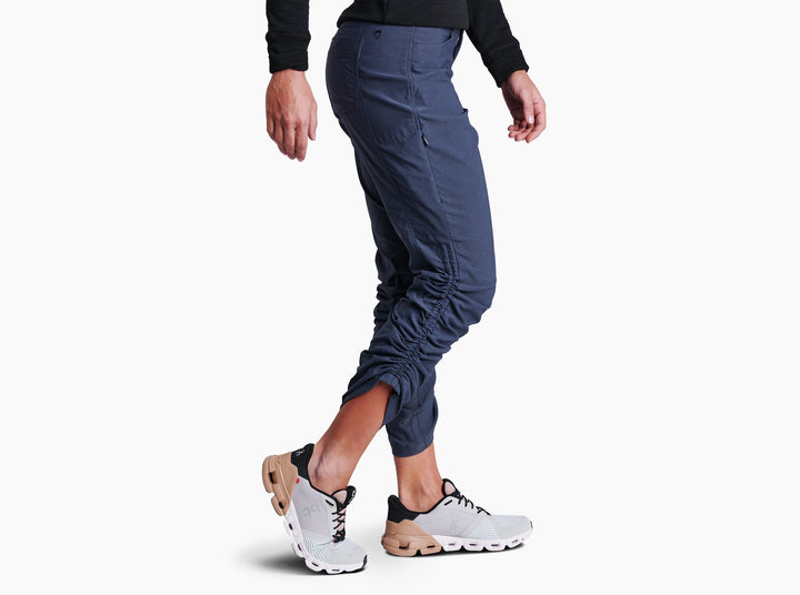 Person wearing Indigo pants on a white background.