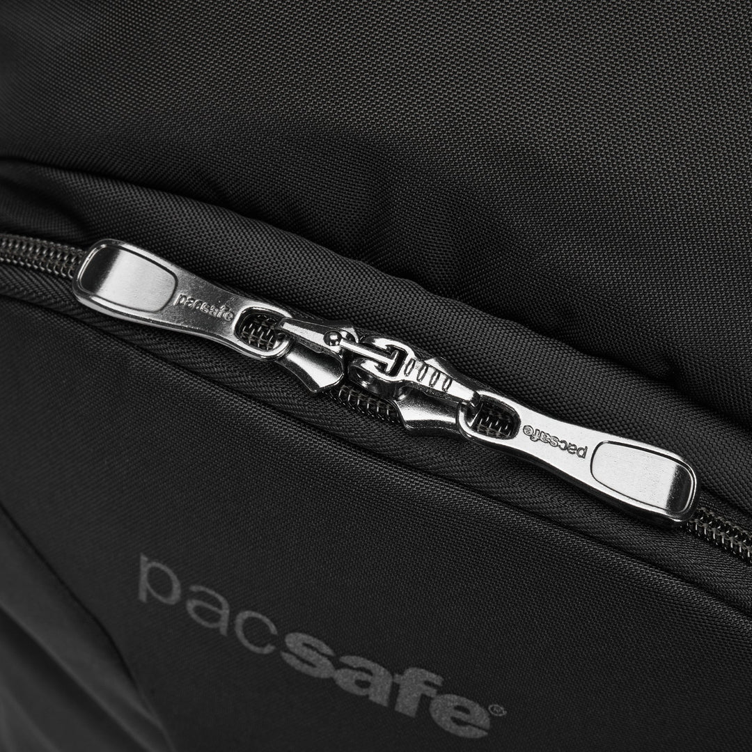 Close up of a lockable zipper at the top of a black Pacsafe branded backpack