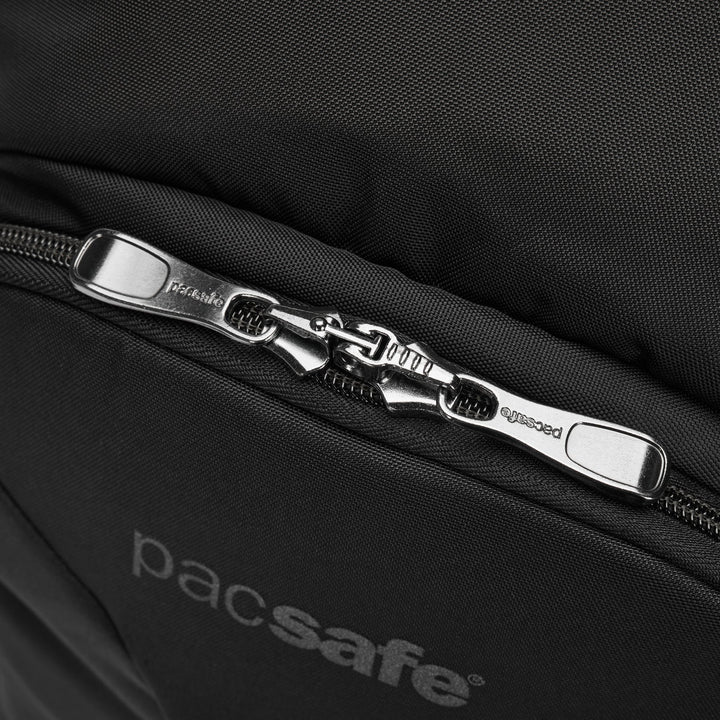 Close up of a lockable zipper at the top of a black Pacsafe branded backpack