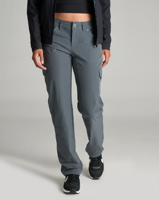 A model wearing a pair of slate gray cargo pants, styled with a black cropped top and black sneakers, shown from the waist down against a neutral gray background.