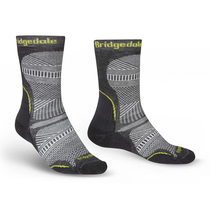 Pair of Grey Bridgedale socks with yellow details on a white background