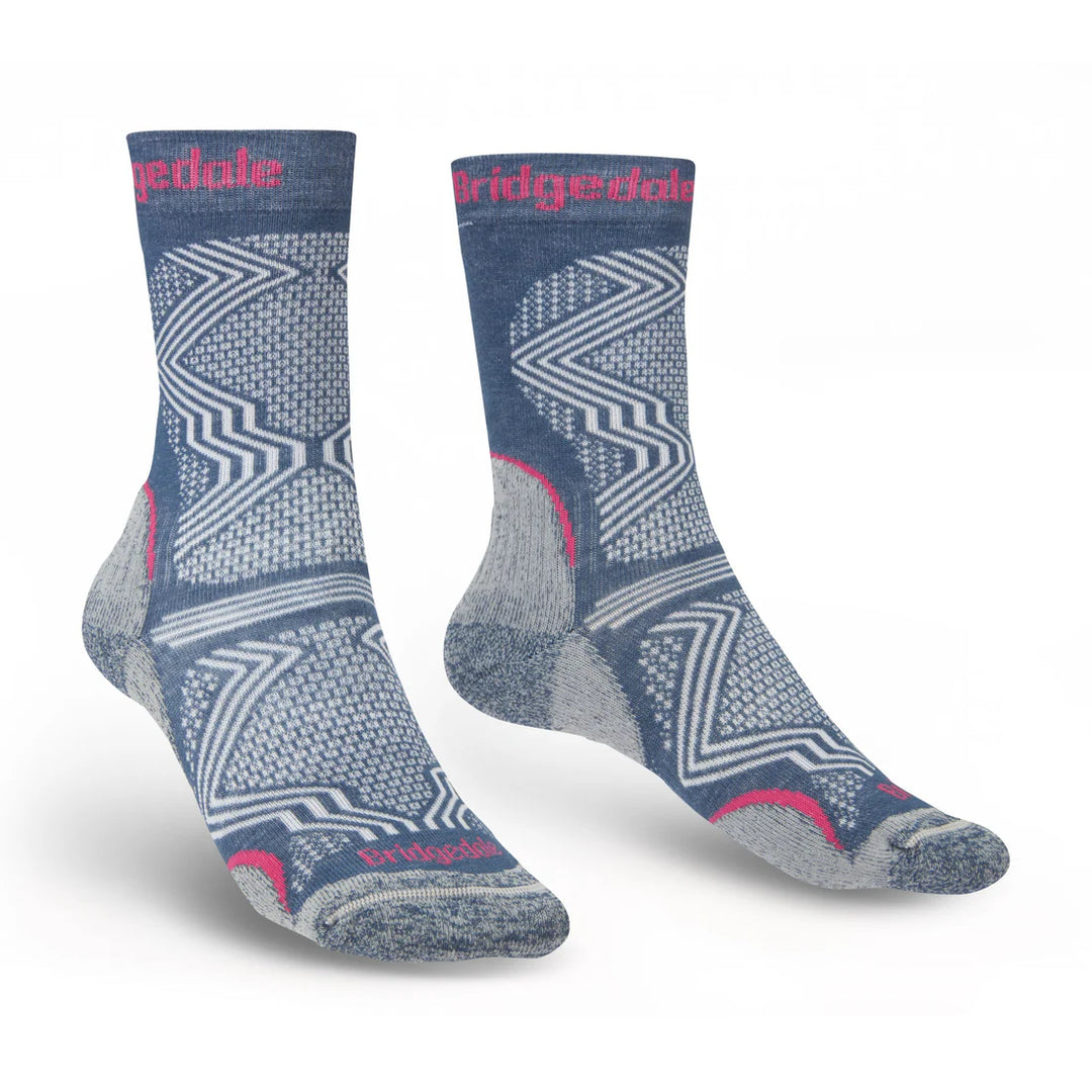 Pair of Blue Bridgedale socks with geometric pattern on a white background