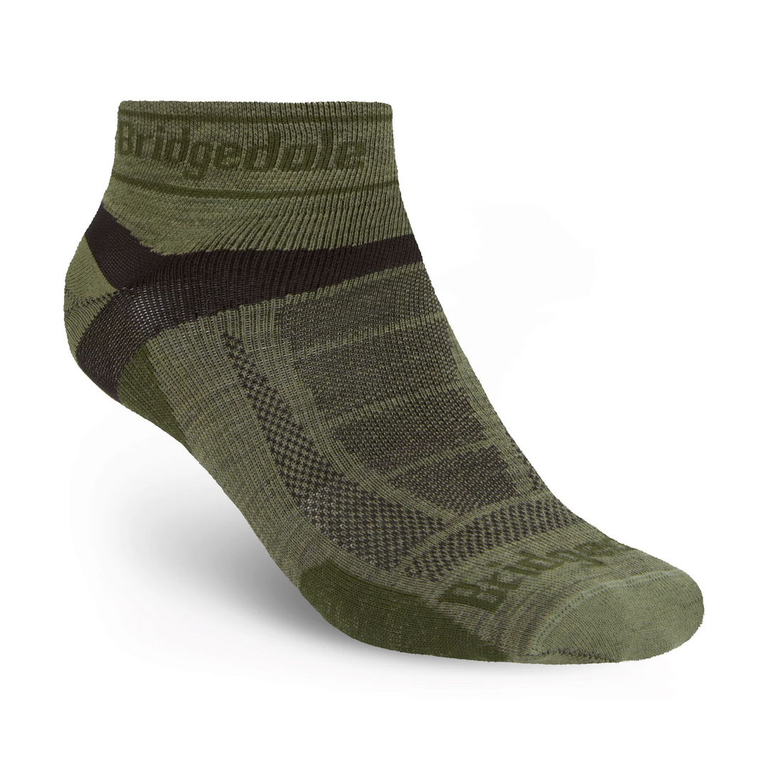 Green ankle sock with black accents on a white background
