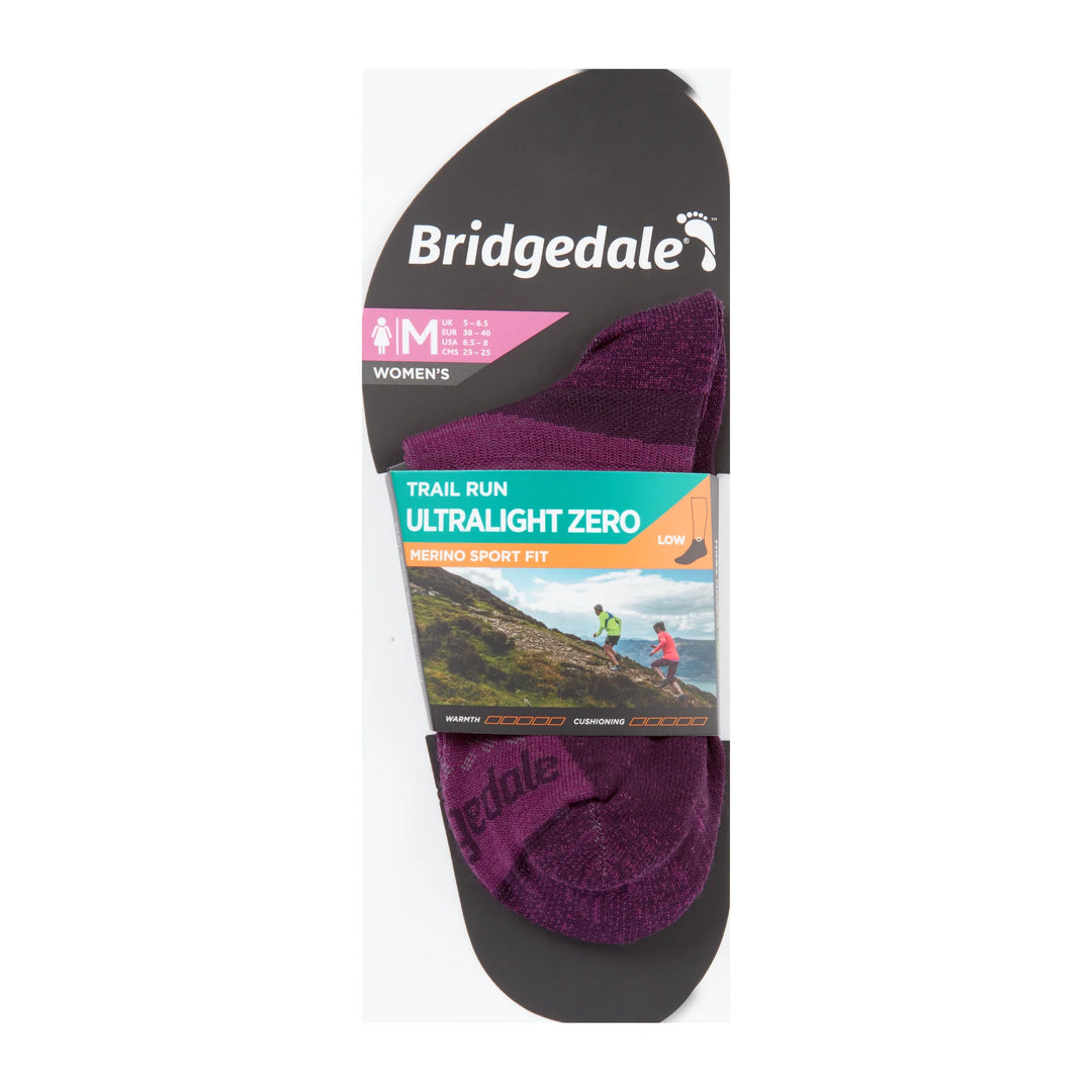 Packaged purple socks with Bridgedale branding on a white background