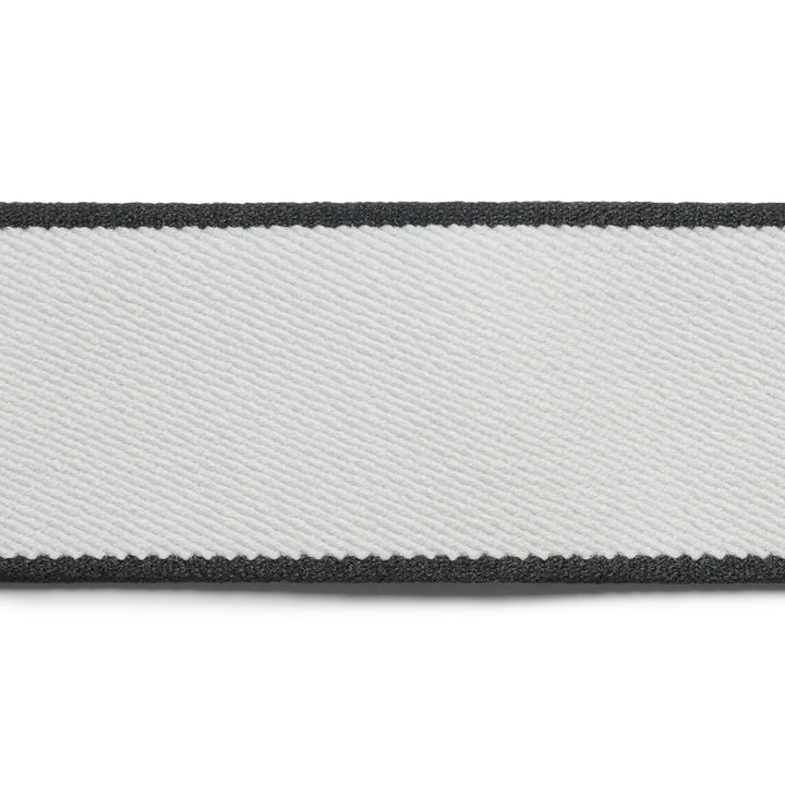 Close-up of a gray and black striped belt on a white background