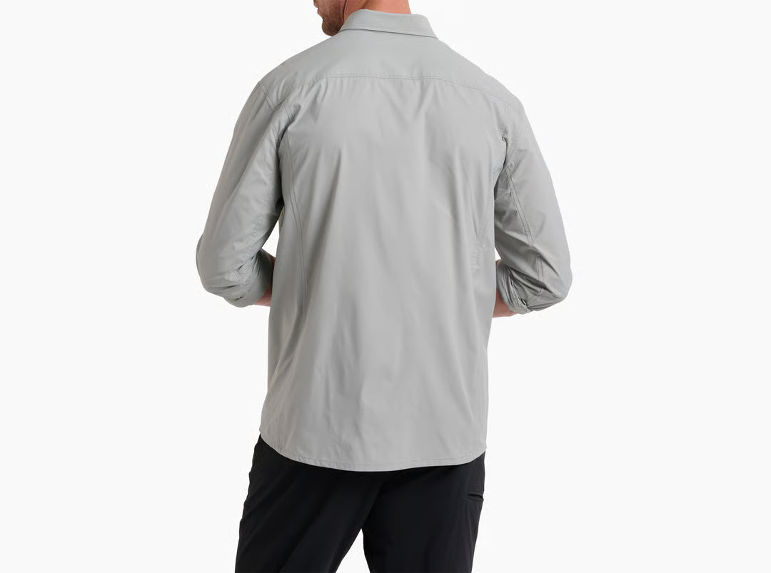 Person wearing a light gray long-sleeve shirt on a white background