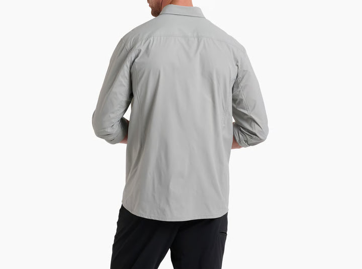 Person wearing a light gray long-sleeve shirt on a white background