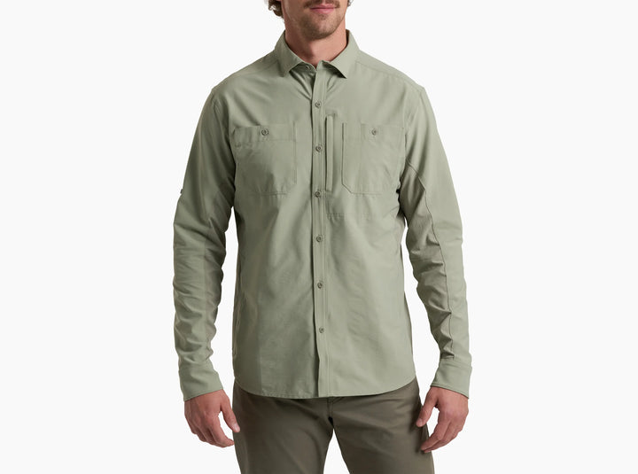 Man wearing a grey button-up shirt on a white background