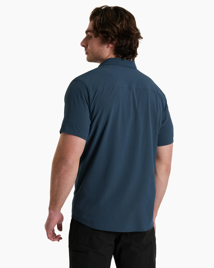 Man wearing a blue polo shirt on a white background