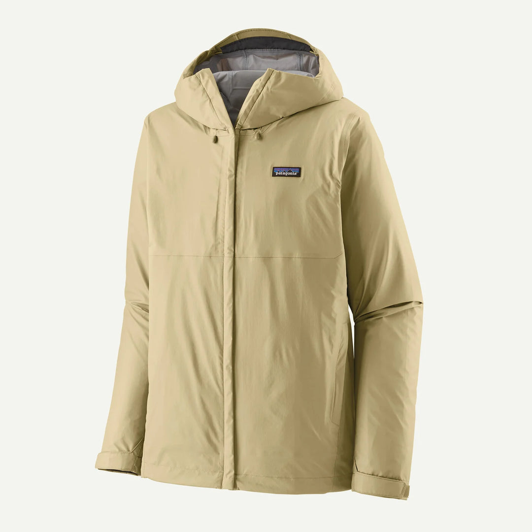 A Patagonia hooded jacket in a light khaki beige color, shown against a plain off-white background. The jacket features a full front zipper, a buttoned snap collar, and the signature Patagonia logo patch on the left chest.