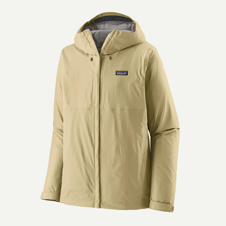 A Patagonia hooded jacket in a light khaki beige color, shown against a plain off-white background. The jacket features a full front zipper, a buttoned snap collar, and the signature Patagonia logo patch on the left chest.