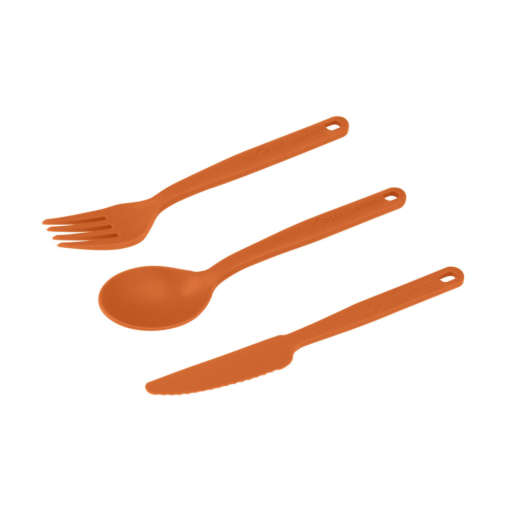 Set of orange plastic fork, spoon, and knife on a white background