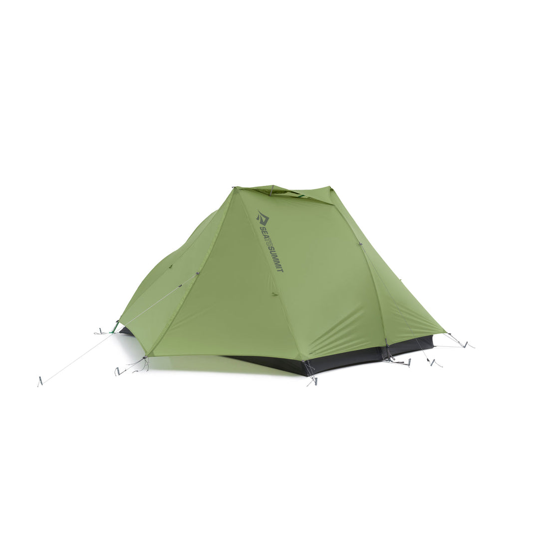 Green hiking tent with four guylines on a white background