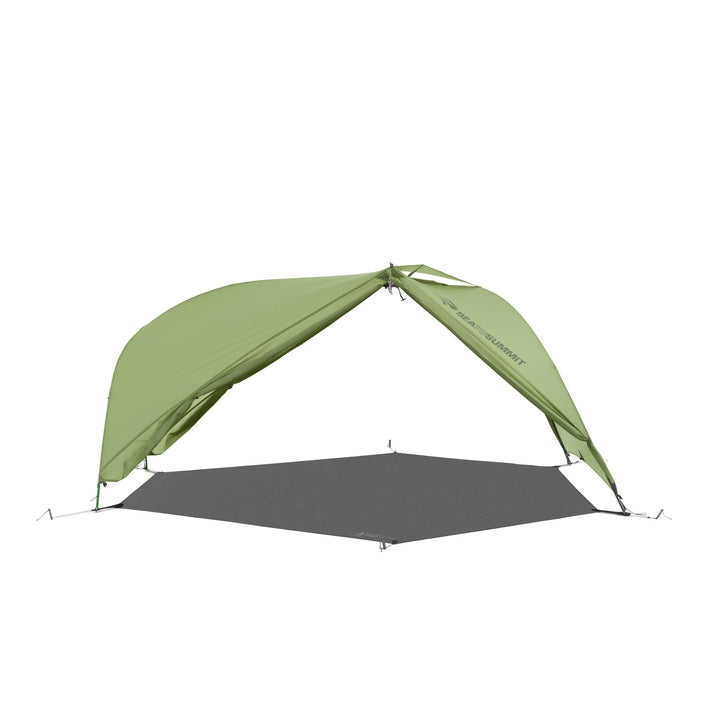 Green hiking tent pitched with a footprint but no inner