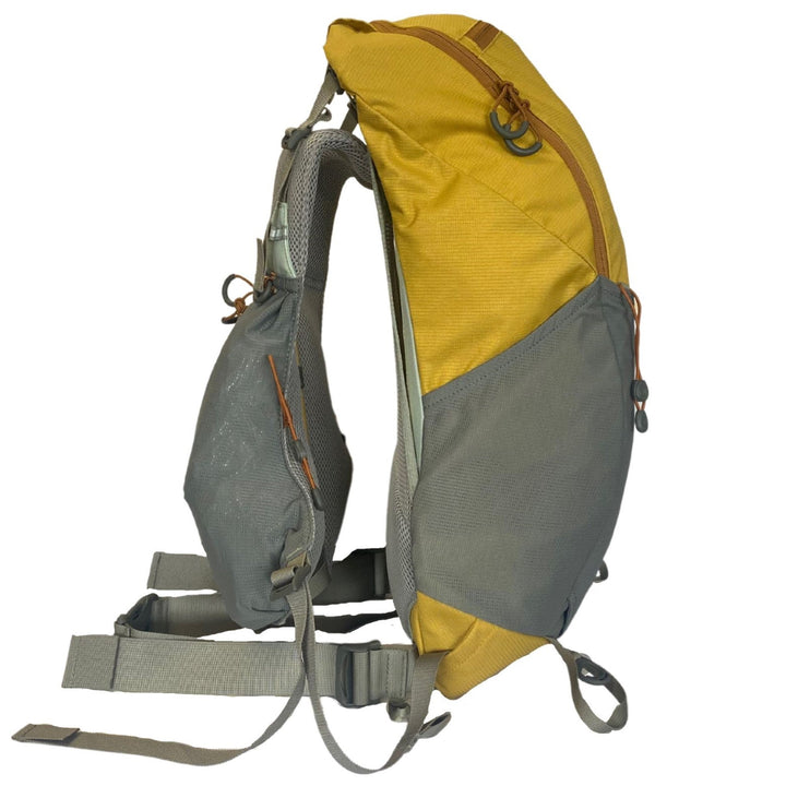 Profile of a yellow and grey day pack on a white background
