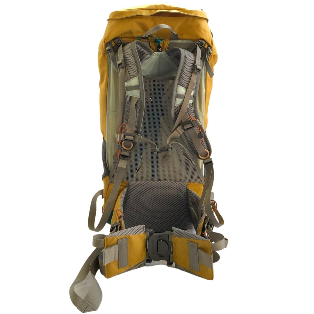 View of the harness of a yellow and grey hiking pack on a white background