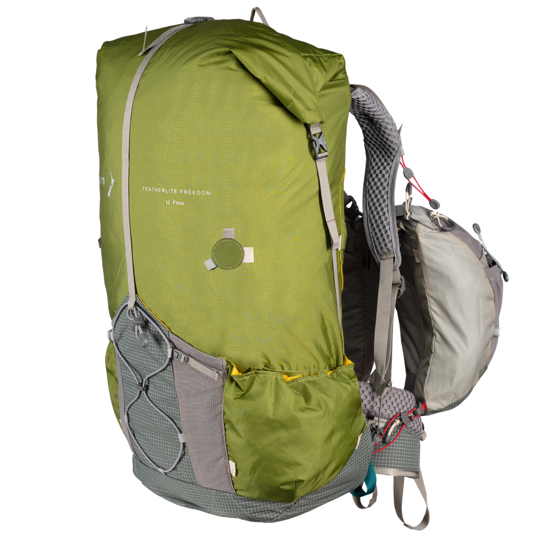 Green hiking backpack with grey straps on a white background