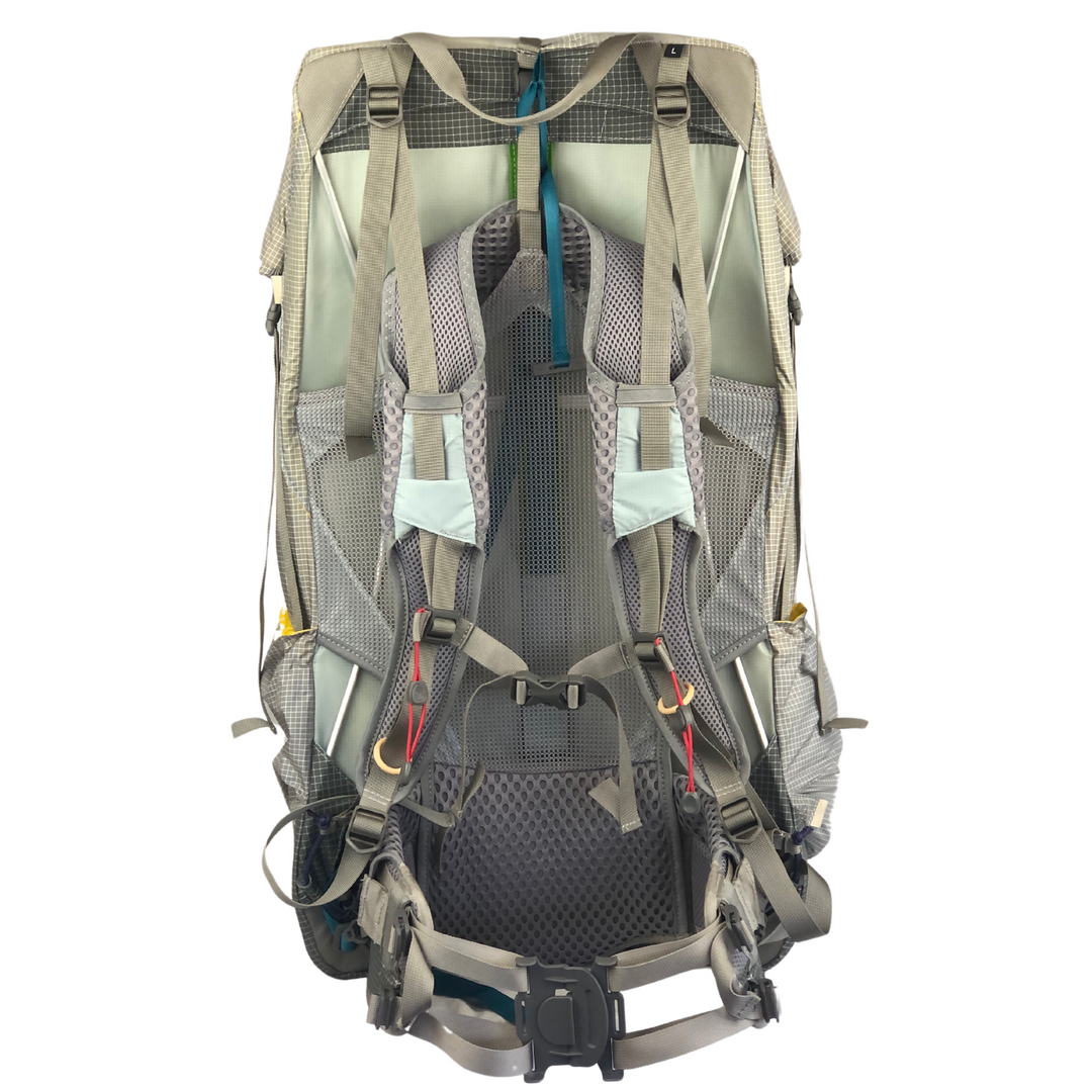 View of the harness of a hiking pack on a white background