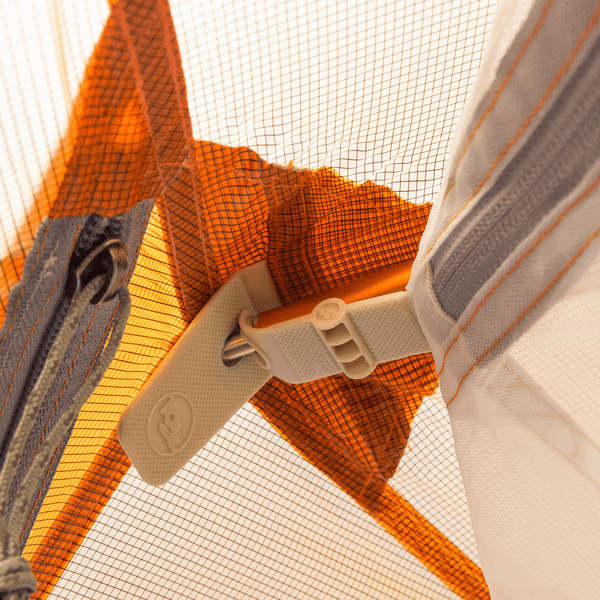 Attachment point of a tent fly and inner to a tent pole