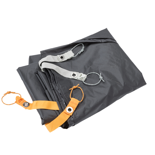 Folded black tarp with orange and silver straps on a white background