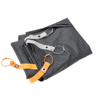 Folded grey hiking tent foot print with orange and grey webbing attachments